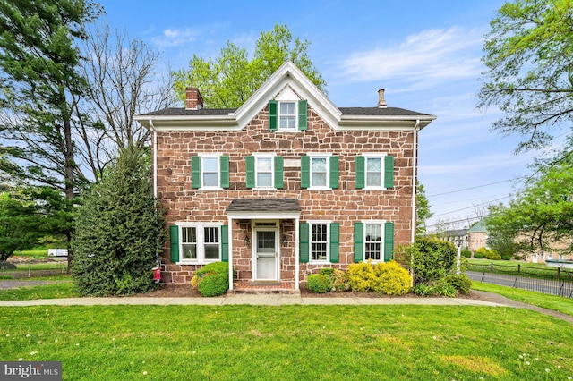 view of front of house with a front lawn