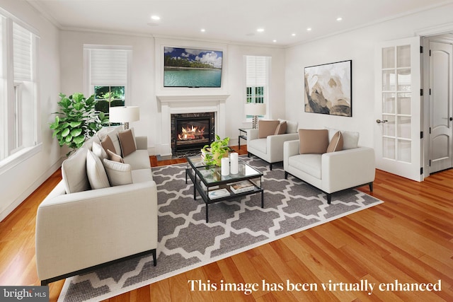 living room with a fireplace, hardwood / wood-style flooring, and crown molding