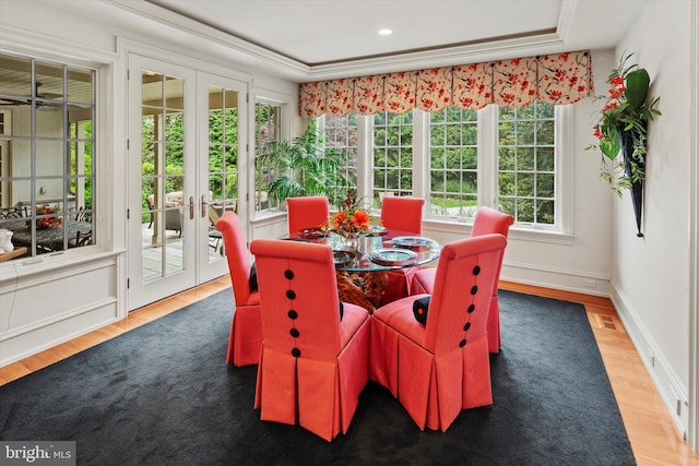 sunroom / solarium featuring french doors