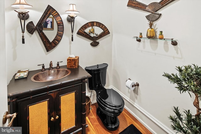 bathroom featuring vanity and hardwood / wood-style flooring