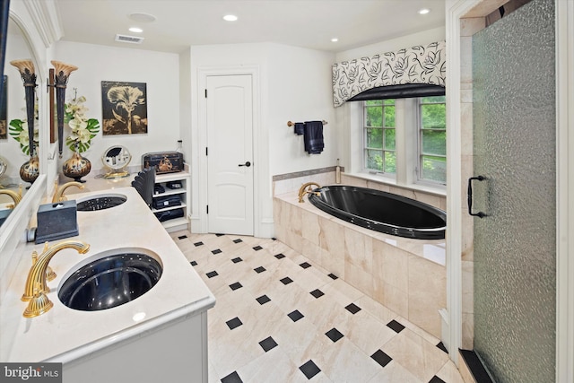 bathroom with plus walk in shower and vanity