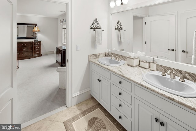 bathroom with tile patterned flooring and vanity