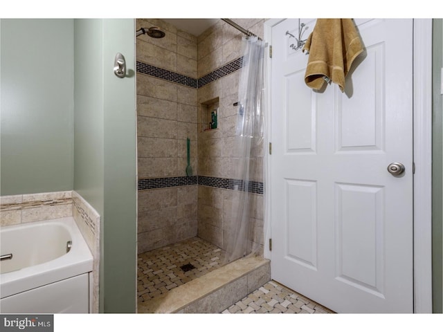 bathroom featuring a shower with shower curtain and tile patterned flooring