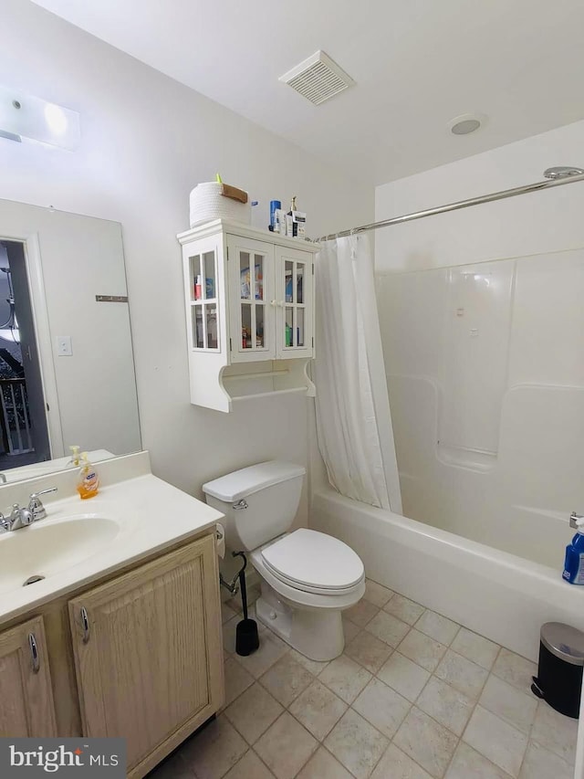 full bathroom with tile patterned flooring, vanity, shower / bath combination with curtain, and toilet