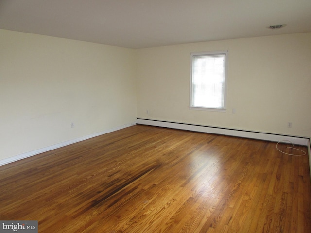 empty room featuring wood-type flooring