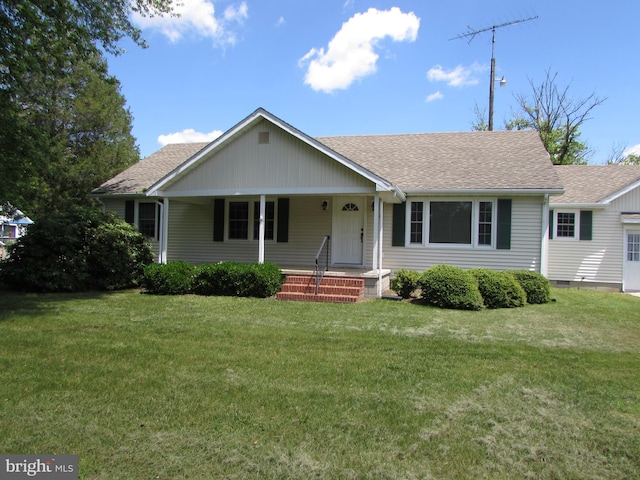 ranch-style home with a front lawn and a porch