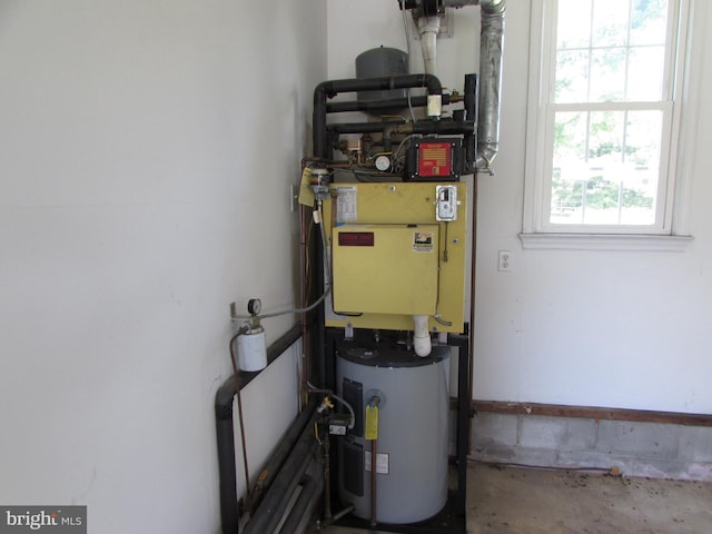 utility room with electric water heater