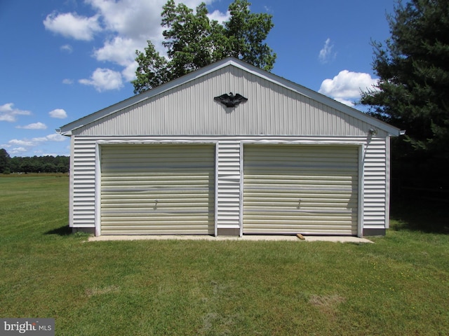 garage featuring a yard