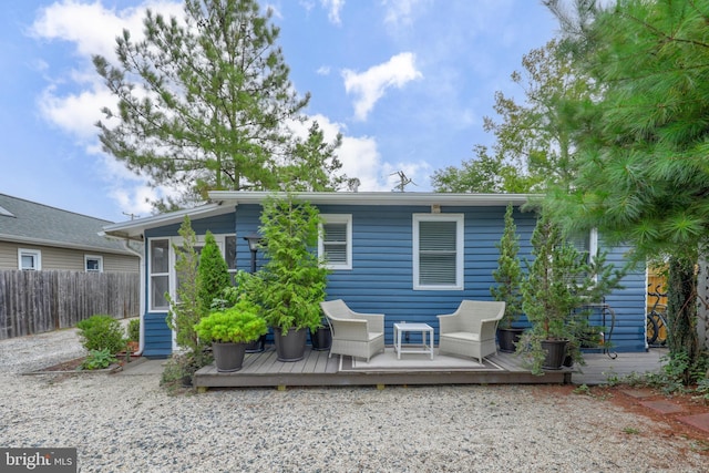 rear view of property with a deck