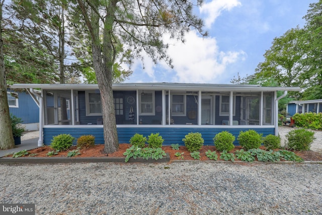 view of front of house with a sunroom