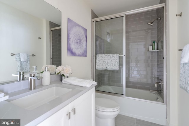 54 Becker Dr Unit 25, Chalfont, PA 18914 - bathroom featuring vanity, toilet, and bath / shower combo with glass door