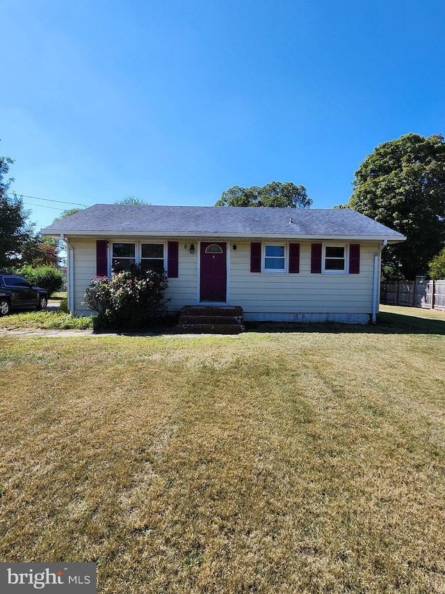 ranch-style house with a front lawn