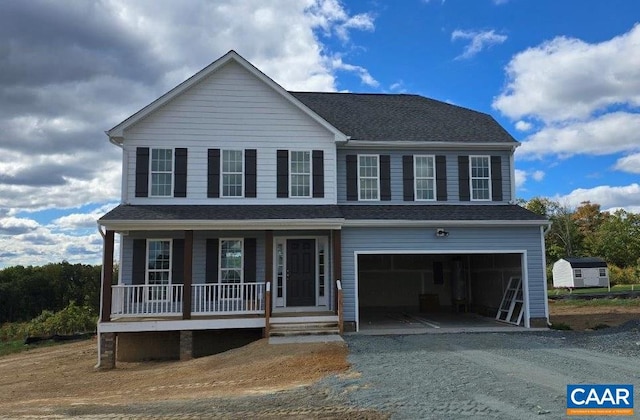 view of front facade with a porch and a garage