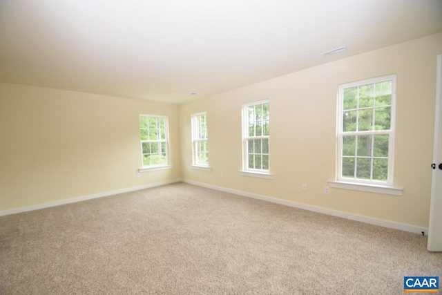 unfurnished room with light colored carpet