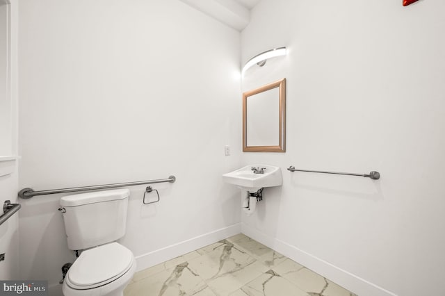 bathroom with toilet and sink