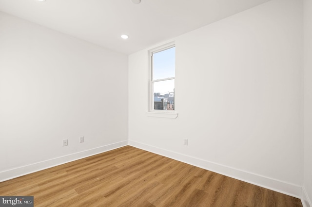 spare room featuring hardwood / wood-style flooring