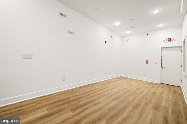 spare room featuring light hardwood / wood-style flooring