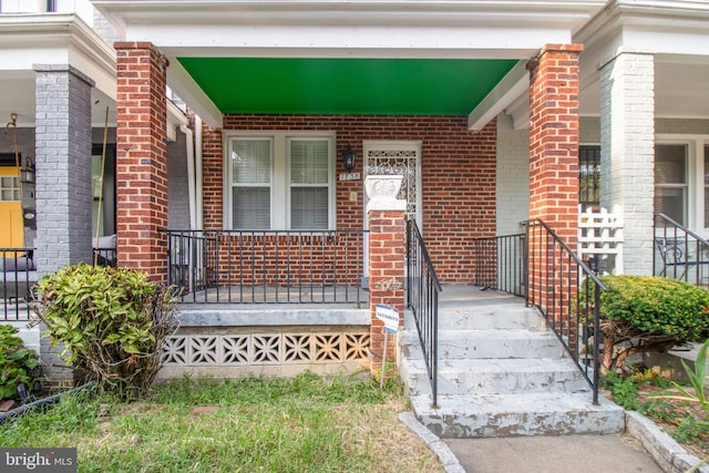 entrance to property with a porch