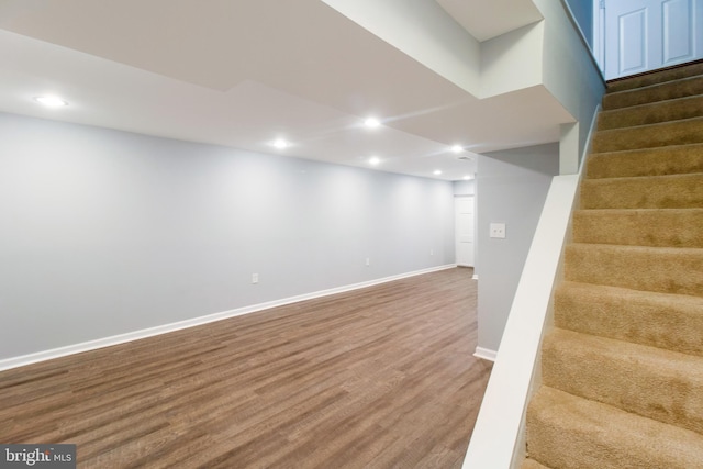 basement with hardwood / wood-style flooring