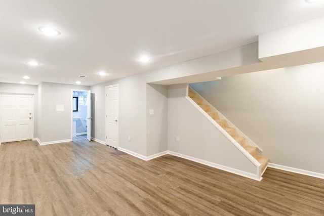 basement featuring hardwood / wood-style flooring