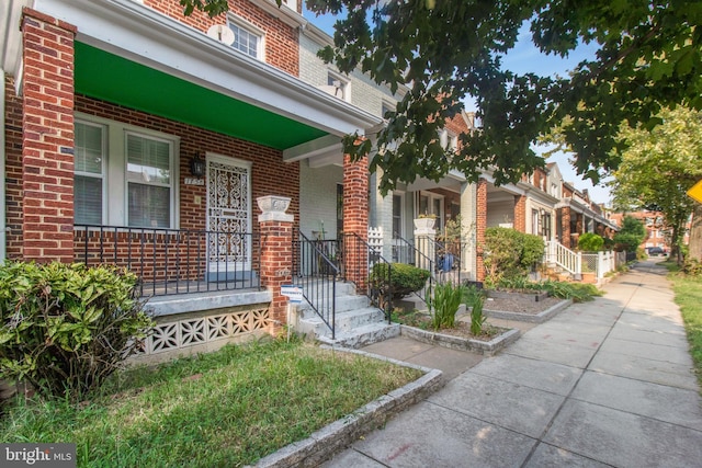 doorway to property with a porch