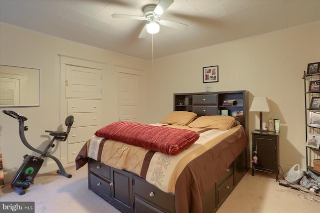 bedroom with light colored carpet, ceiling fan, and ornamental molding