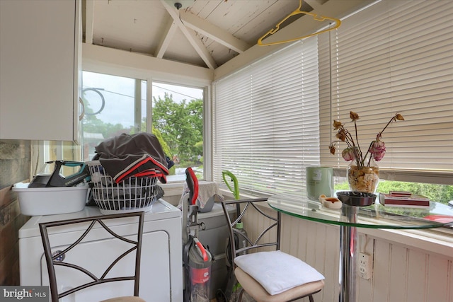 sunroom / solarium with washer / clothes dryer and lofted ceiling with beams