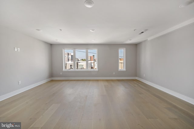 spare room featuring light hardwood / wood-style flooring