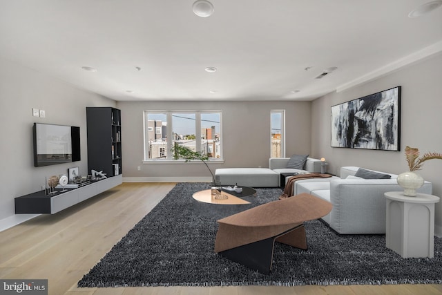 living room with light hardwood / wood-style floors