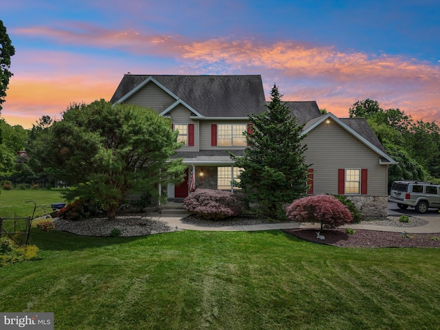 view of front of home with a yard