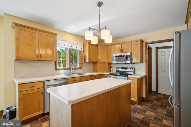 kitchen with stainless steel appliances, sink, decorative light fixtures, a chandelier, and a center island