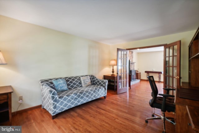 office space featuring french doors and hardwood / wood-style flooring