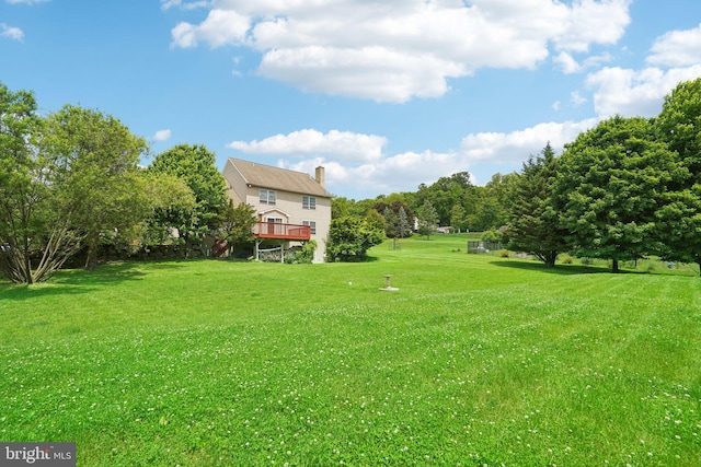 view of yard with a wooden deck