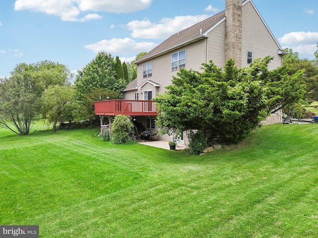 view of yard with a patio and a deck