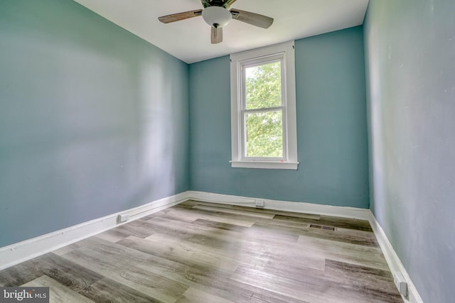 spare room featuring ceiling fan and light hardwood / wood-style floors