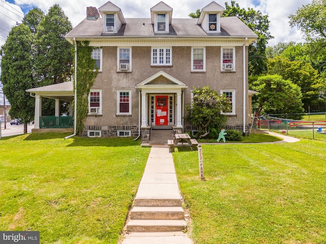 view of front of home with a front lawn