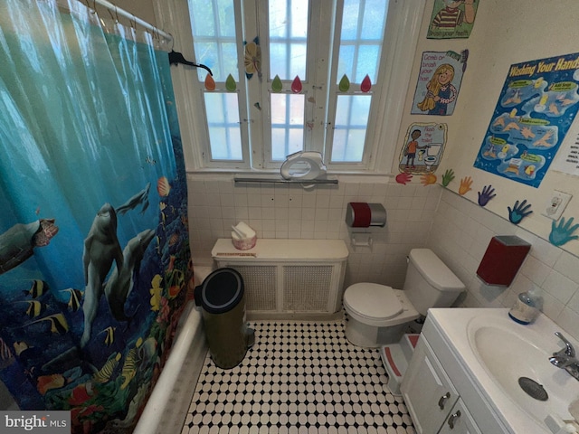 full bathroom with radiator, shower / bathtub combination with curtain, toilet, vanity, and tile walls