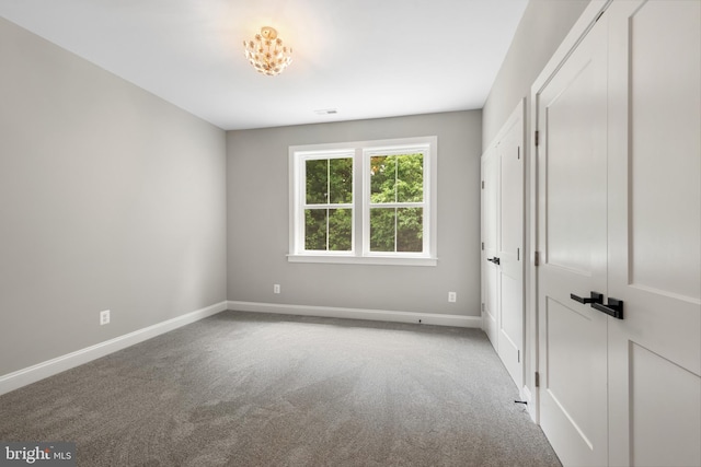 unfurnished bedroom with light carpet