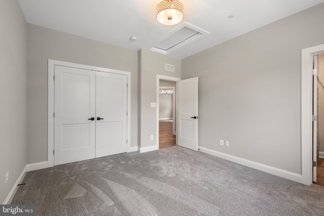 unfurnished bedroom with carpet floors and a closet