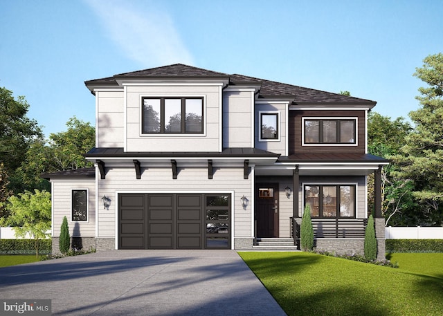 view of front of home featuring a garage and a front yard