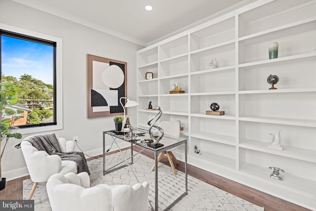 home office featuring ornamental molding, baseboards, and wood finished floors