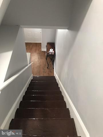 603 Allendale St, Baltimore, MD 21229 - staircase featuring wood finished floors and baseboards