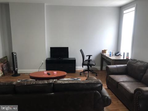 living room with wood-type flooring