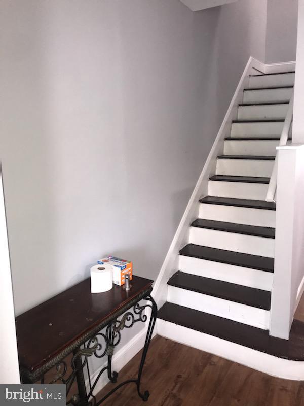 stairway with wood-type flooring