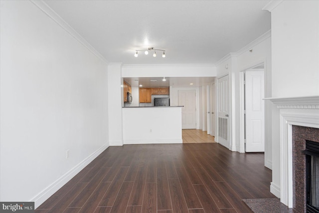 unfurnished living room featuring crown molding