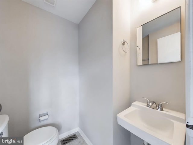 bathroom with toilet and sink