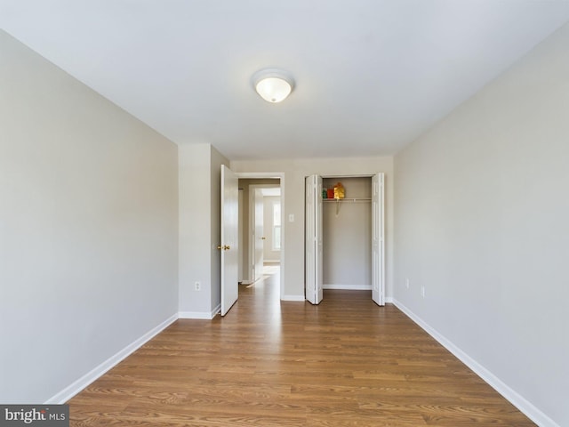 unfurnished room featuring hardwood / wood-style flooring