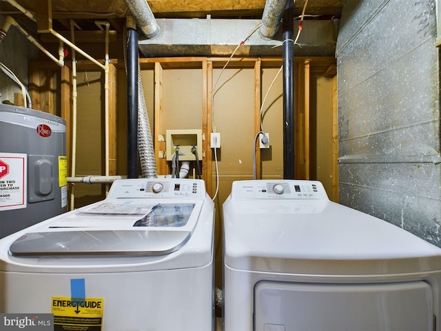 washroom featuring electric water heater and washer and dryer