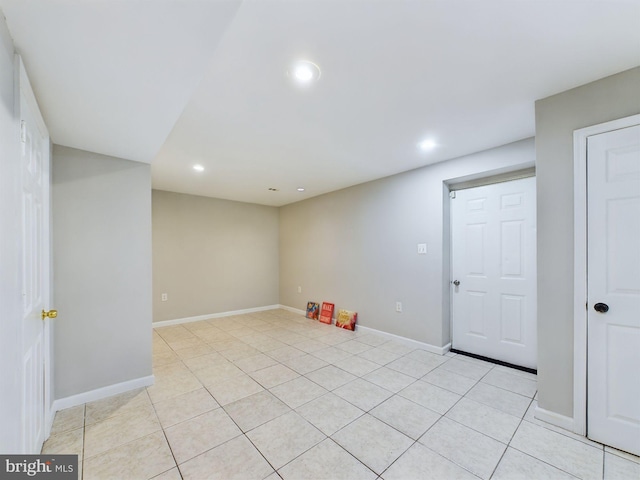 unfurnished room with light tile patterned floors