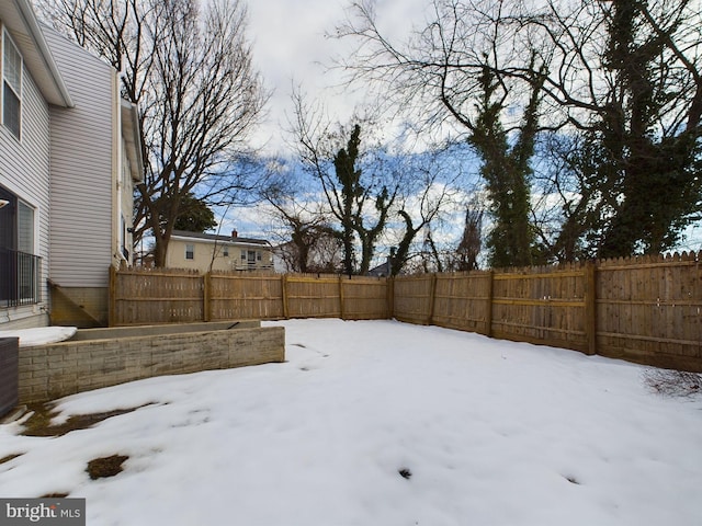 view of yard covered in snow